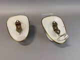 two pairs of shoes that are sitting on a table