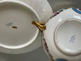 a close up of a tea pot and saucer on a table