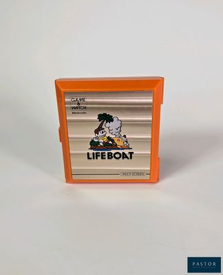 un boîtier de jeu Nintendo orange posé sur une surface blanche