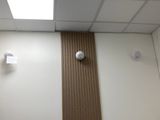 a light that is on above a toilet in a bathroom
