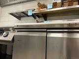 many stacks of bread on the shelves in the kitchen