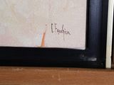 a picture of a painting on a shelf in a room