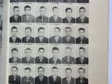 an old photo of a book with a bunch of men in military uniforms