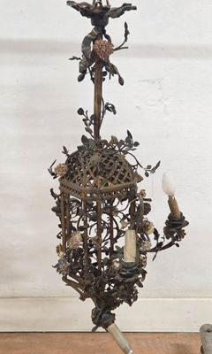 a candle holder with a bird on it on a table