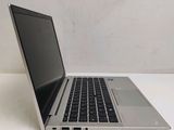 a laptop computer sitting on a table with a white background