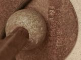 a brown object on the floor next to a brown object on the floor