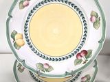 four plates stacked on top of each other with fruit on them