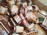 a cardboard box full of food that is sitting on a table