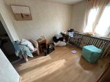 a baby crib in the corner of a room with a baby crib in the corner