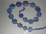 necklace made of blue glass beads with tassels and a tassel