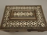 a white and brown box sitting on top of a table