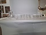 a table that has a lot of glasses on it