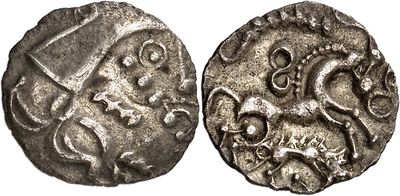 a silver coin with an image of a man on a horse