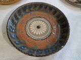 three plates that are sitting on a table