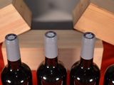 several bottles of wine are lined up in a row on a table