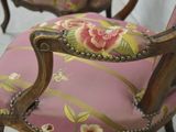 a pink chair with a floral design on it