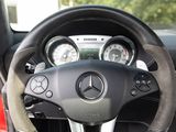 a steering wheel and dashboard of a car in a car