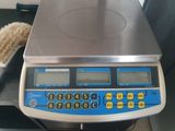 an image of a scale with a brush on top of it