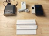 several electronic devices are sitting on top of a wooden table