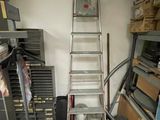 a ladder that is leaning against a wall in a room