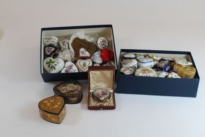 two boxes of chocolates and a heart shaped box of candy