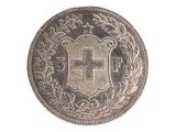 une image représentant une pièce d'argent sur laquelle figure la lettre h