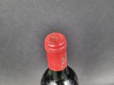 a bottle of wine that is sitting on a table