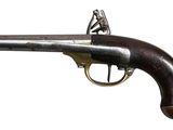 an old gun with a wooden handle on a white background