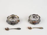 two spoons and a spoon rest next to each other