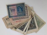 a pile of old currency sitting on top of a table