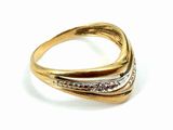 a close up of a gold ring with diamonds on a white background