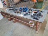 a workbench with tools on it in a garage