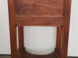 an image of a small wooden table with a shelf on top of it