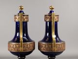 pair of blue and gold vases with gold trim and handles