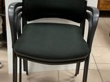 a black chair with a black seat and a black chair with a black seat and a black chair with a black seat and a black chair with a black