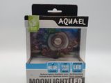 une image représentant une boîte contenant une lampe, posée sur une surface blanche