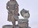 bronze figurine of a girl with a pot and a dog