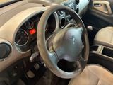 dashboard of a car with a steering wheel and dashboard controls