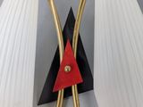 pair of art deco wall lamps in the style of person