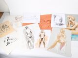 a lot of drawings that are on a table