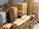 many boxes stacked on top of each other in a room