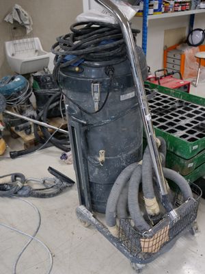 an image of a room that has a bunch of tools on the floor