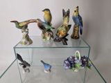 a glass display case with a bunch of figurines on it
