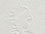 a close up of a piece of white paper with a drawing of a woman