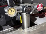 a beer tap on the counter in a bar