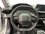 the interior of a car with a steering wheel and dashboard controls
