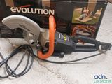 an image of a corded circular saw sits on the floor next to a box of tools