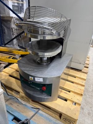 a machine that is sitting on a pallet in a warehouse
