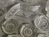 a lot of glass dishes and bowls on the table