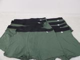 three pairs of men ' s boxers with black and green waistbands